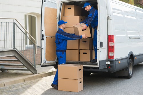 Team carrying out safe loading procedures beside a moving van