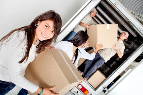 Mover wearing PPE while handling furniture safely