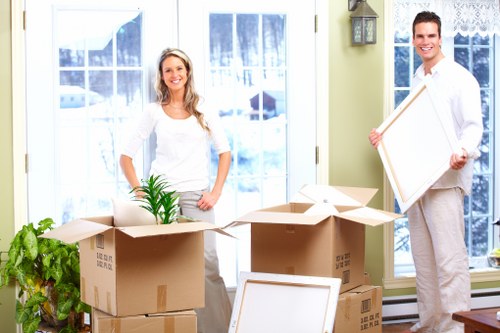 Mover handling boxes and household items during a Crystal Palace relocation